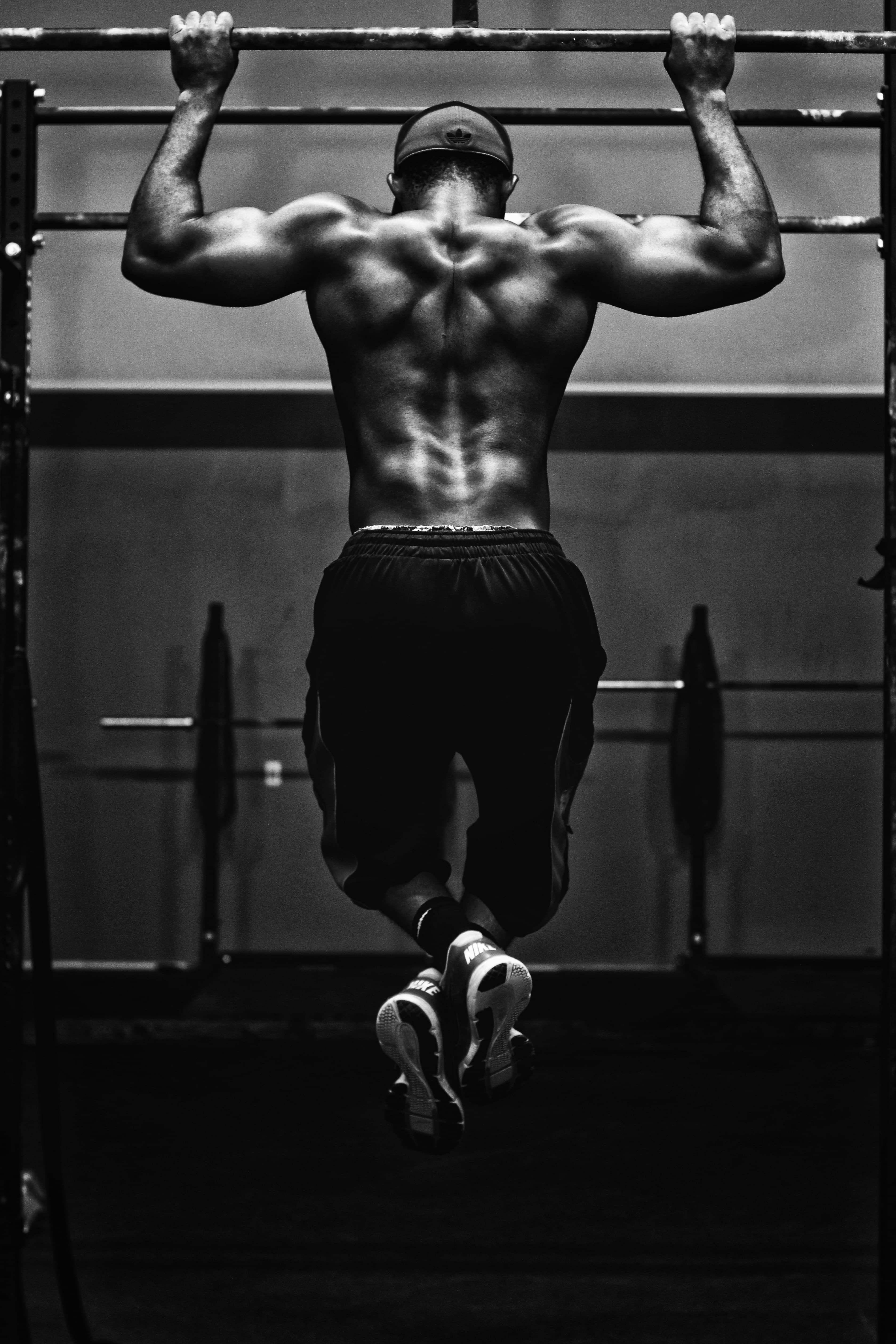 Athlete performing a pull-up under pressure