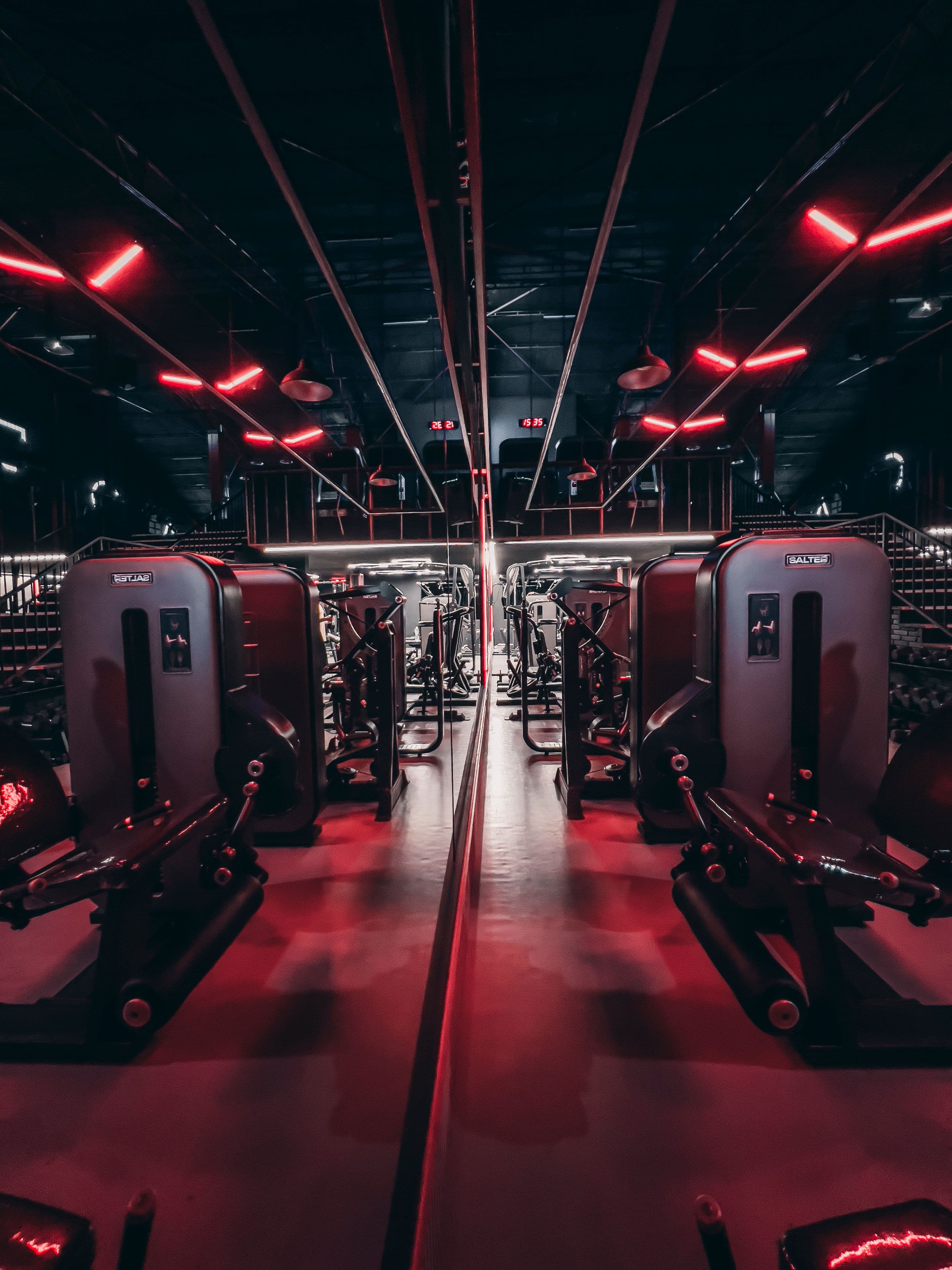 A symmetrical gym illuminated with red lights